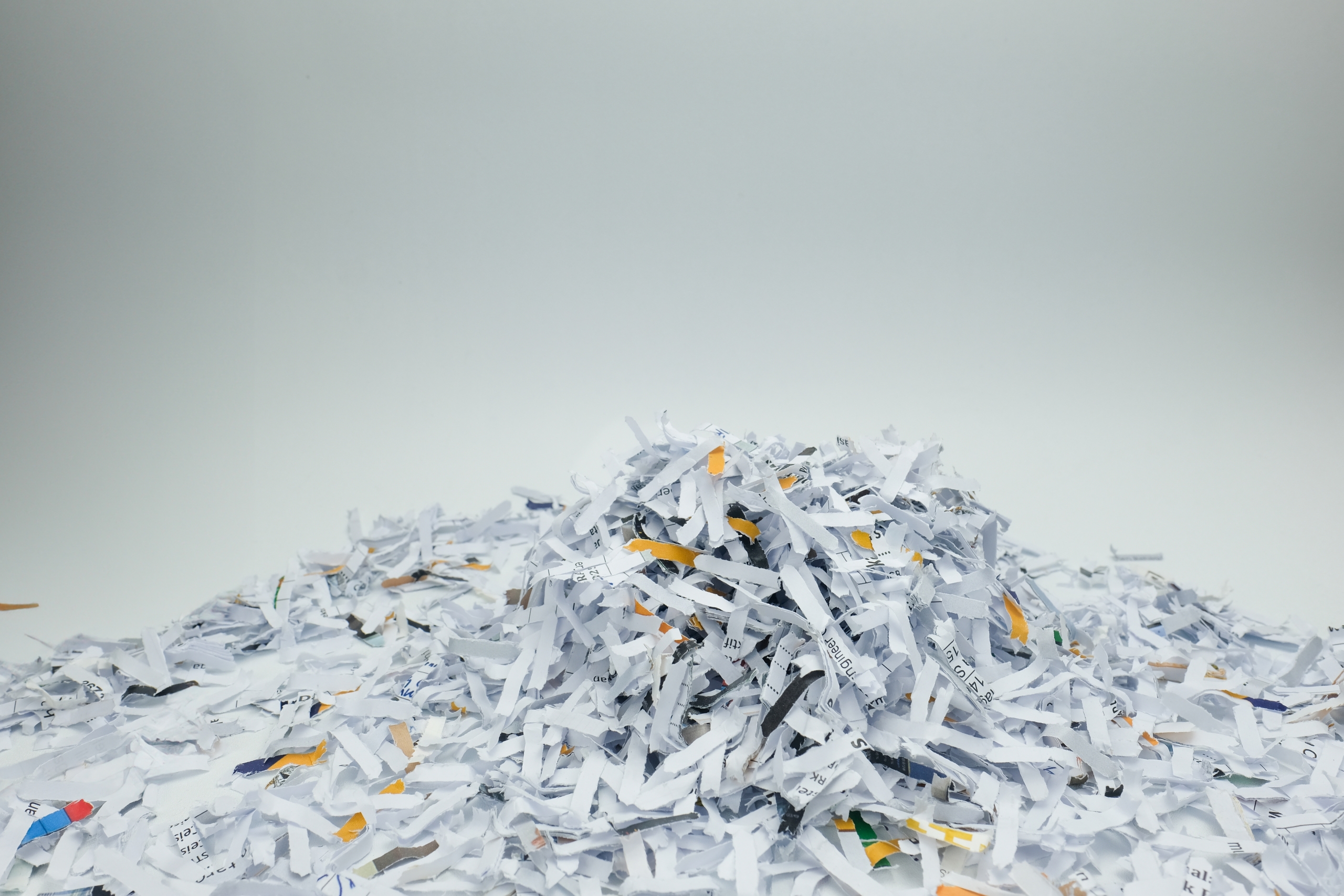 A,Large,Pile,Of,Shredded,Paper,Spread,Across,A,White