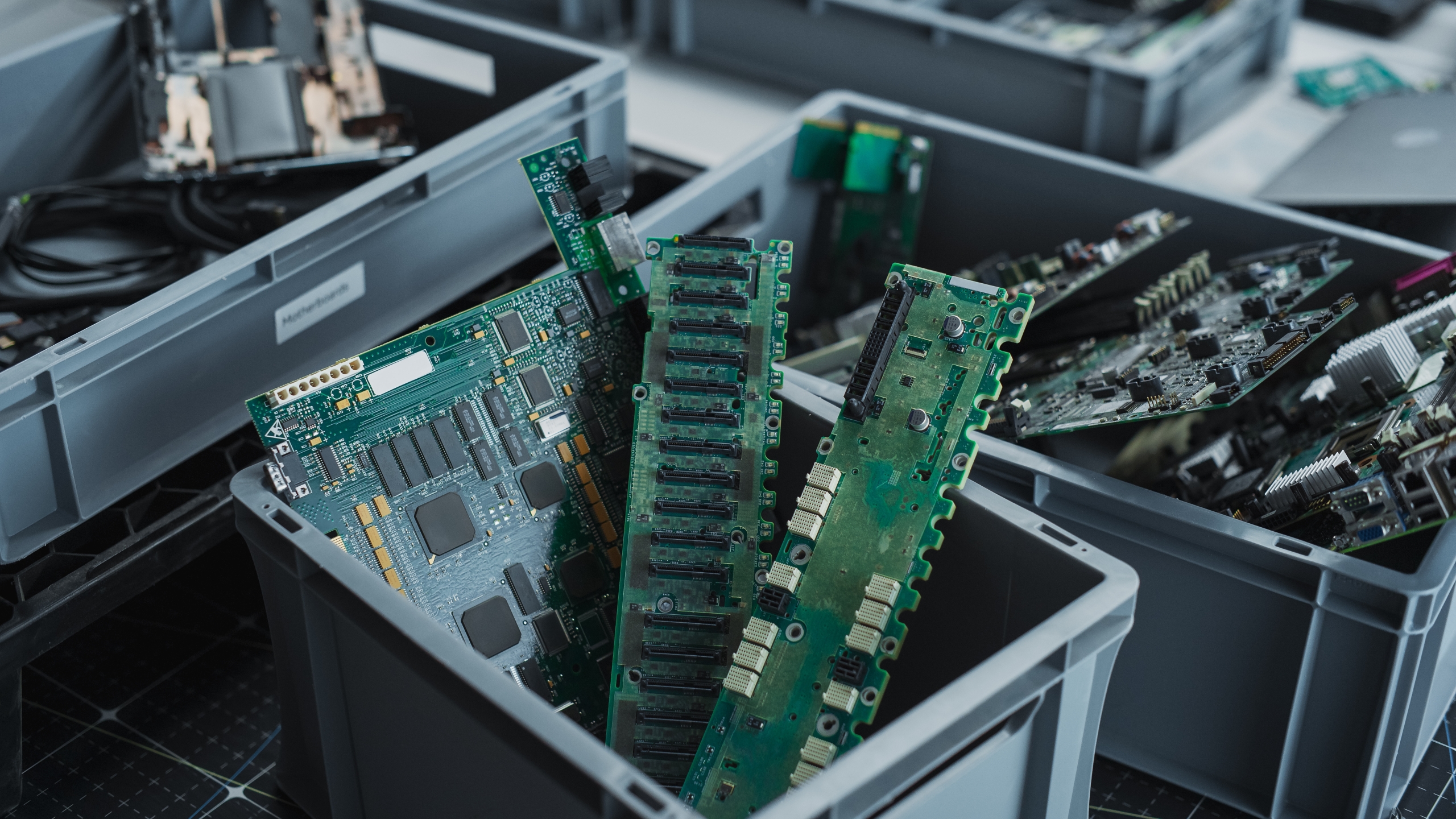 Close-up,Shot,Of,Boxes,With,Computer,Parts,Sorted,For,Recycling