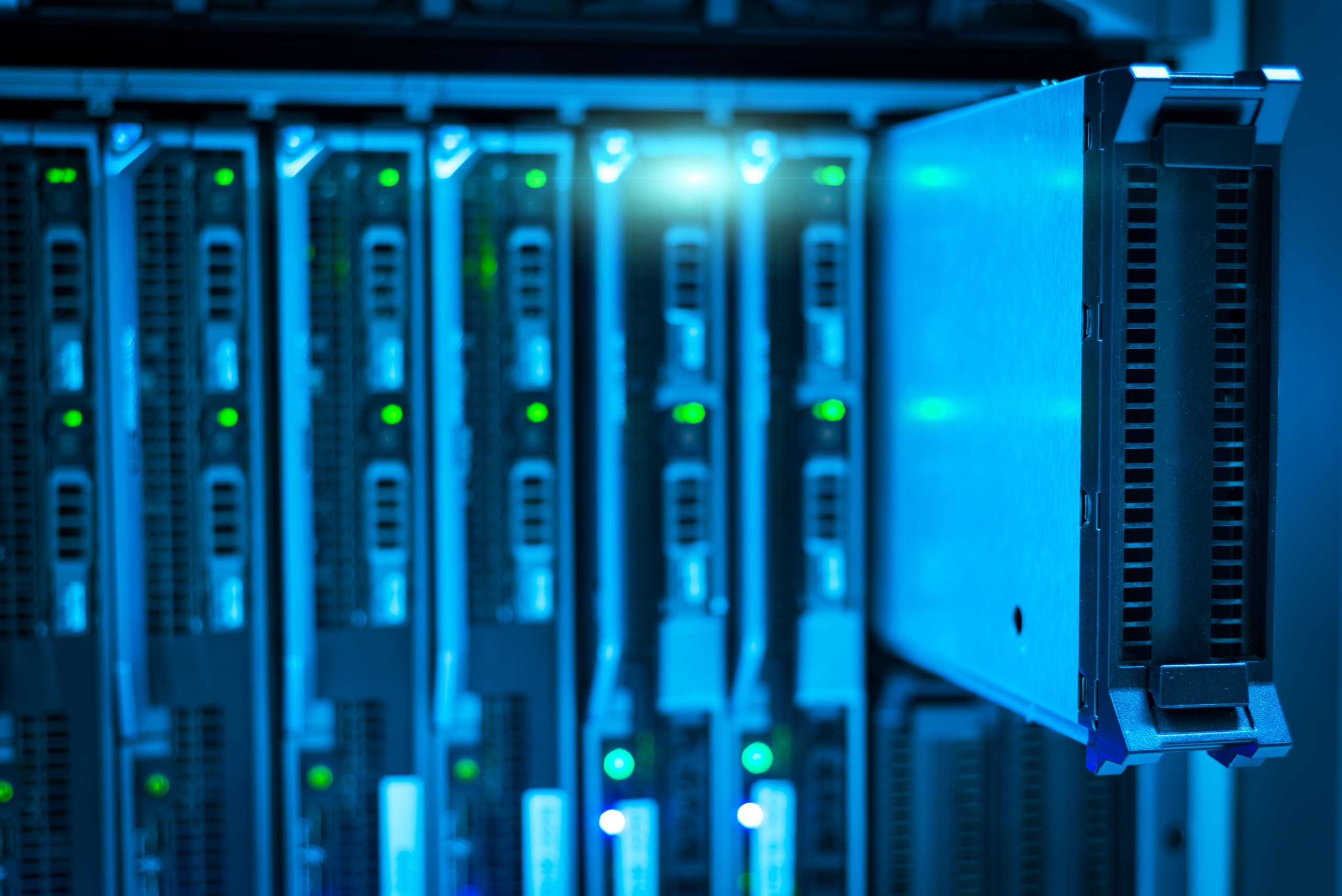 Servers and storage devices being pulled out as a part of a company's equipment removal procedure.