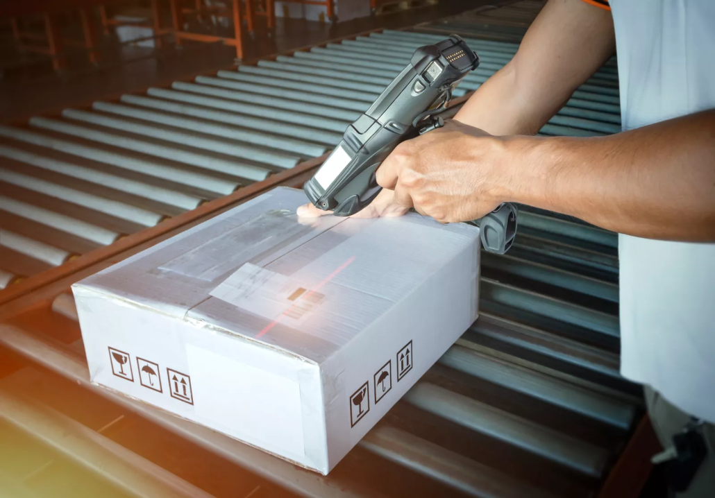 IT asset barcode scanning technician scanning computer inventory