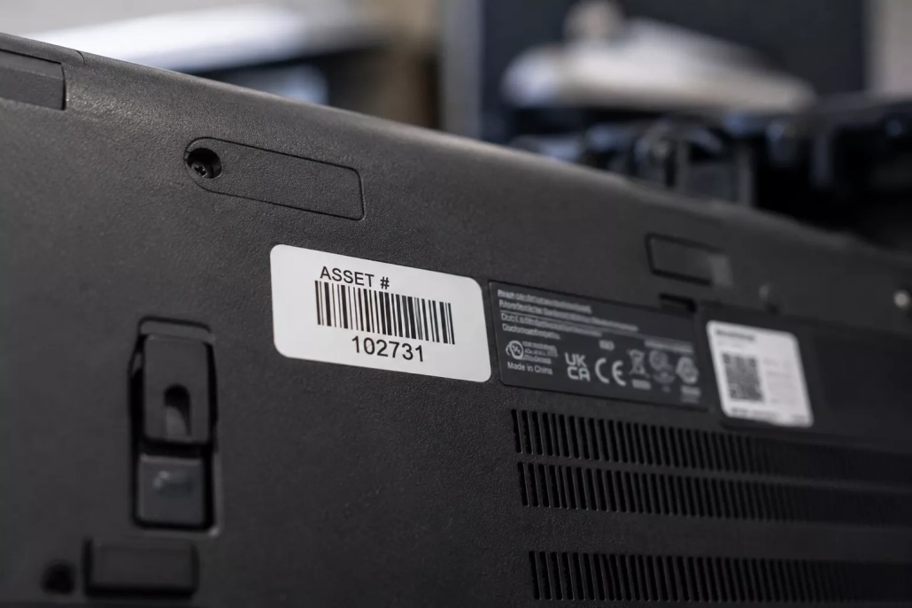 Asset tag and serial number used to identify equipment in an IT asset inventory